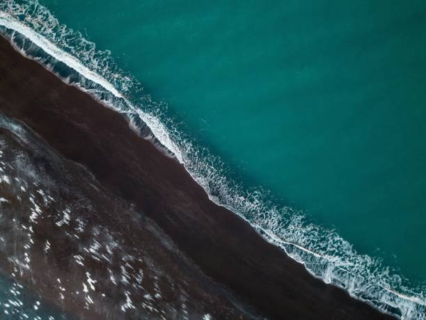 istock Volcanic beach, green sea 1459355715