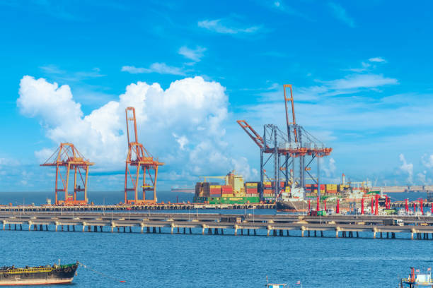 istock Engineering shipping crane depot at logistic export terminal control. Warehouse freight background container yard loading quayside harbor port. Logistics seascape shipping portal concept 1459356640