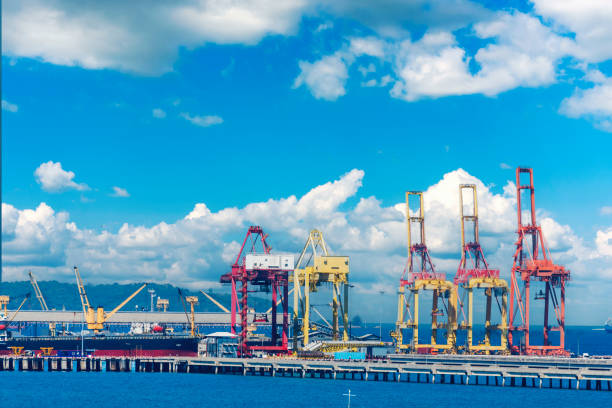 istock Engineering shipping crane depot at logistic export terminal control. Warehouse freight background container yard loading quayside harbor port. Logistics seascape shipping portal concept 1459356776