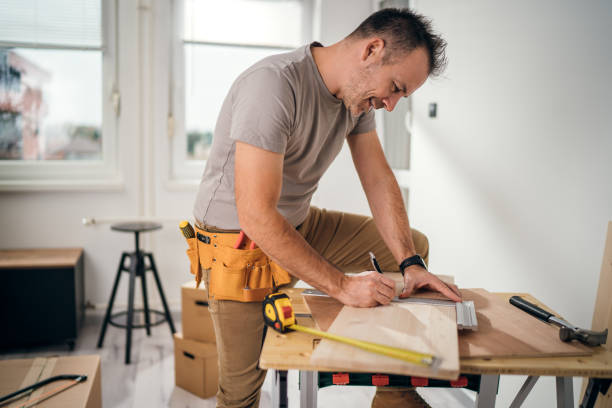 istock Professional carpenter at work measuring wooden planks 1459357952