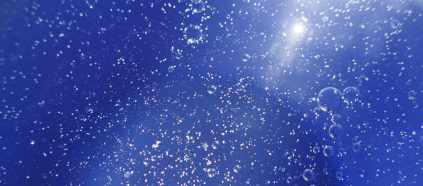 istock Oil bubbles close up. circles of water macro. abstract light blue background 1459358027