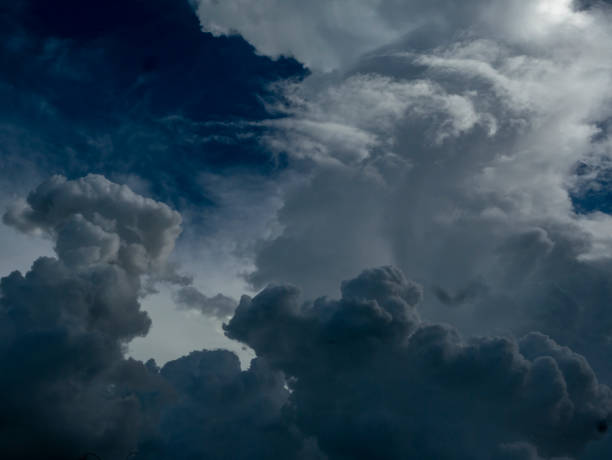 istock Dark thunderstorm clouds rainny landscape. Meteorology danger windstorm disaster climate. Dramatic dark storm thundercloud rain clouds on black sky background.Dark cloudscape storm disaster gray sky 1459359258