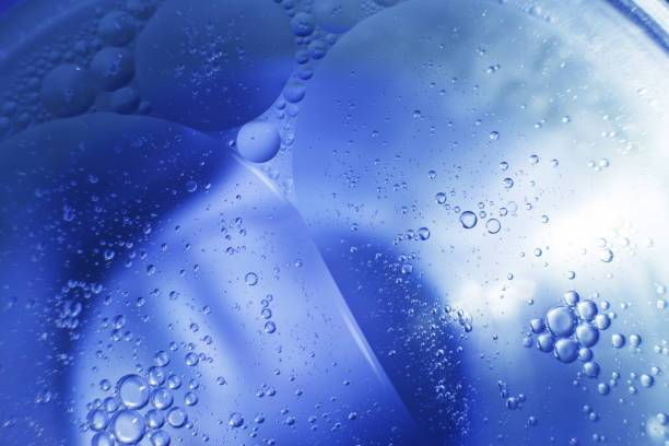 istock Oil bubbles close up. circles of water macro. abstract light blue background 1459359330