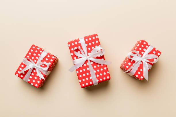 istock Valentine day composition Background: red gift box with bow and heart. Christmas present. View from above. Holday greeting card 1459360665