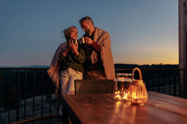 istock Senior couple enjoy mountain evening. 1459360681