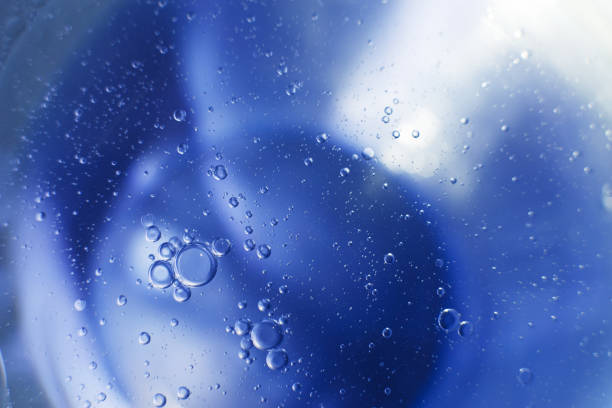 istock Oil bubbles close up. circles of water macro. abstract light blue background 1459360783