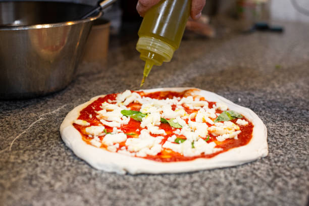 istock Preparing Italian traditional pizza. 1459361449