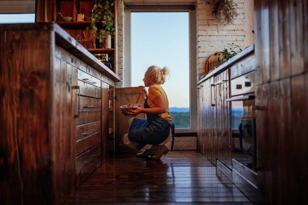 istock Senior woman in kitchen. 1459362586