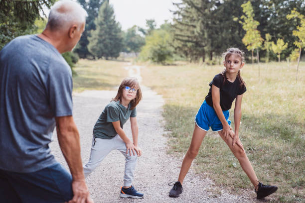 istock Kids and their coach are doing workout trainings in the park. 1459362606