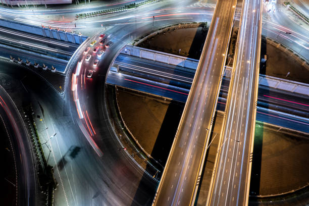 istock Expressway top view, Road traffic an important infrastructure, Drone aerial view fly in circle, traffic transportation, Public transport or commuter city life concept of economic and energ, transport. 1459363405