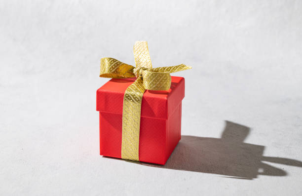 istock Craft box on a yellow textured background. The concept of ecological packaging and zero waste. Mock up. 1459363720