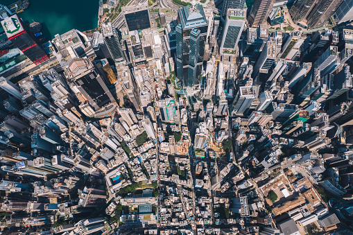 Aerial scenery panoramic view from drone of Hong Kong modern skyscrapers district. Top view, urban downtown with corporate business and financial enterprise buildings. Metropolitan city infrastructure