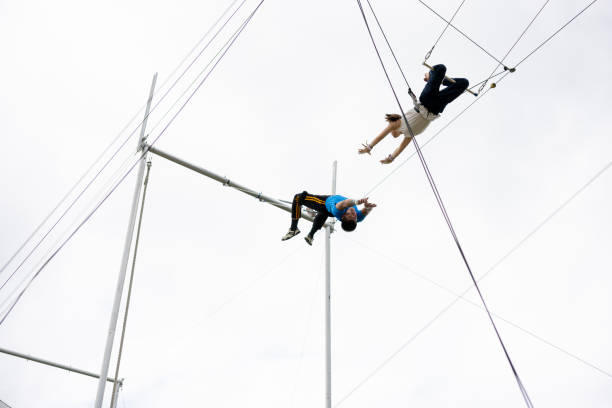 Trapeze artists flying in the sky