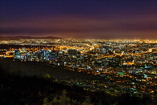 Brightly lit Cape Town CBD and suburbs at night from Signal Hill