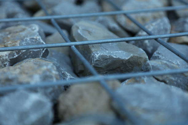 Fence with gabions and stones