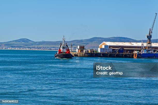 Tug Boat Entering Cape Town Harbour Stock Photo - Download Image Now - Bay of Water, Beauty In Nature, Black Color