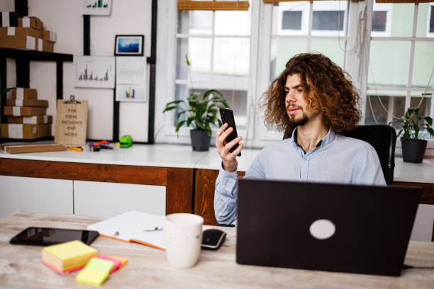 istock Young man spending time on social networks during coffee break 1459370499