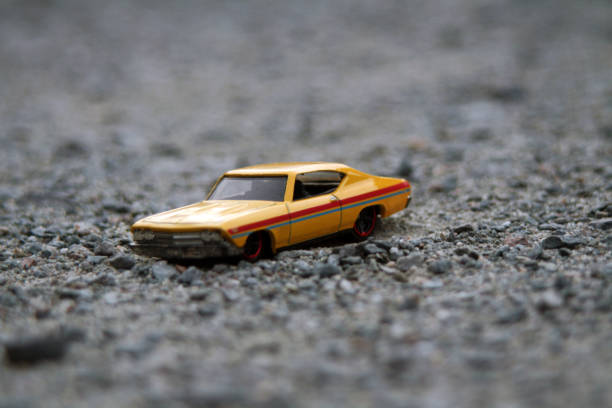 istock yellow miniature toy car 1459375132