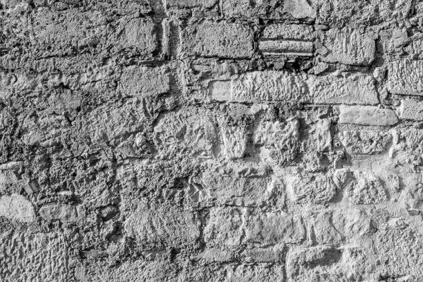 istock Wall from big stones, close-up. Old stone wall background texture for publication, poster, calendar, post, screensaver, wallpaper, postcard, banner, website. Toned high quality photo 1459375313