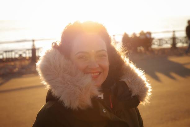 istock pretty woman at sunset on the seafront in brighton,england 1459376268