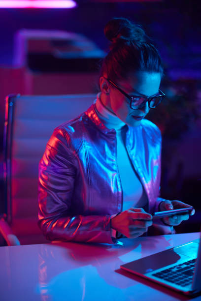 istock stylish woman in glasses using smartphone app 1459377249