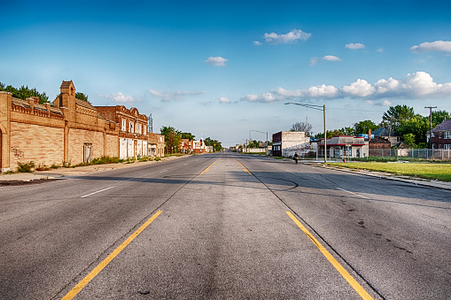 A view of Hamilton Avenue on a sunny day shows a street empty of traffic.