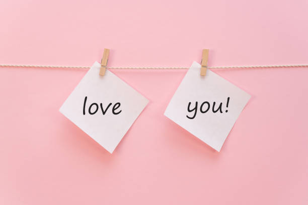 istock White sticker on a rope with a clothespin with an inscription 1459378417