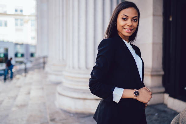 istock Successful entrepreneur adjusting jacket in urban street 1459381897
