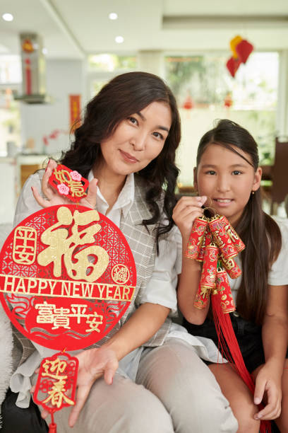 istock Mother and Daughter Showing Pedants 1459382816