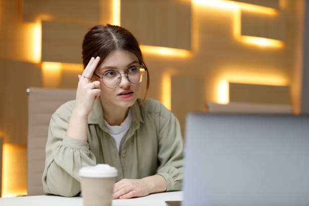 istock Young business woman thinks with her head at the workplace in the office, problem solving. 1459383539