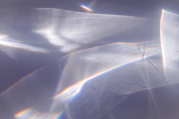 istock Sunlight background, abstract photo with light and shadow, glare and shine on paper texture, rainbow flare from sun, gray blue minimal aesthetic fon. Natural light and caustic effects. 1459384172