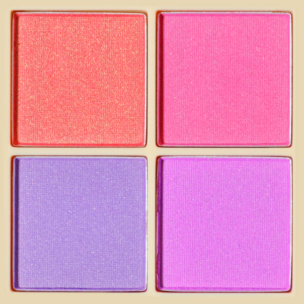 istock Cosmetic beauty product texture, multi-colored eyeshadows for makeup in square package as background, pink violet purple colors textures powder for eye, color pallete, top view, close up 1459384186