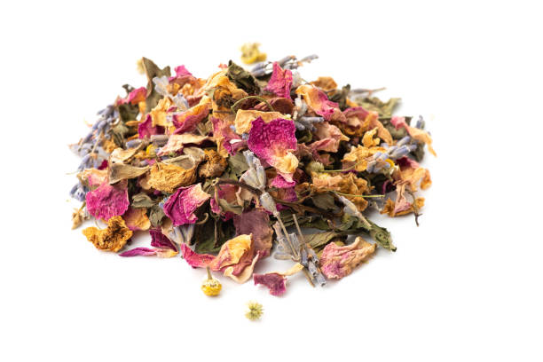 istock tea pile of lavender, chamomile, rose petals, mint on white background. 1459386559