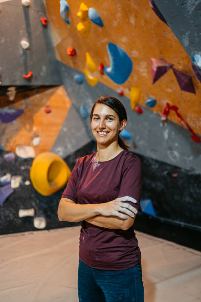 istock Young Female Climber In Front Of A Climbing Wall 1459386734