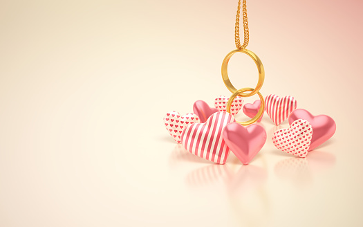 3d Render Gold Wedding Rings attached to chain & Heart Ornaments, For Engagement, Wedding, Love and Valentine's Day Concepts (Close-up)