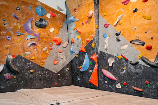 Indoor climbing wall for practicing rock climbing.