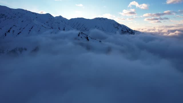 Flying among the ocean of clouds in the mountains