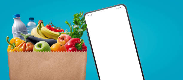 istock Full grocery bag and smartphone 1459391815