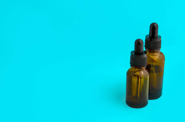 istock Glass vials on a blue background. 1459391833