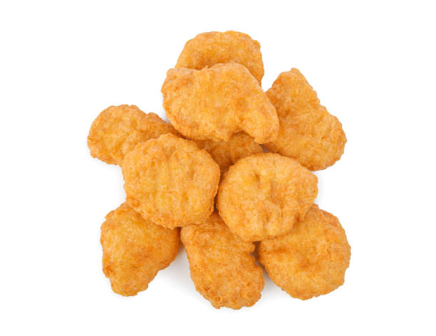 istock Fried chicken nuggets isolated on white 1459392591