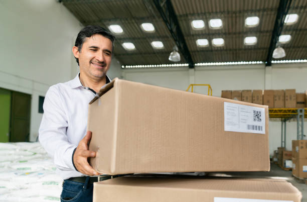 istock Business man working at a warehouse shipping packages 1459394324