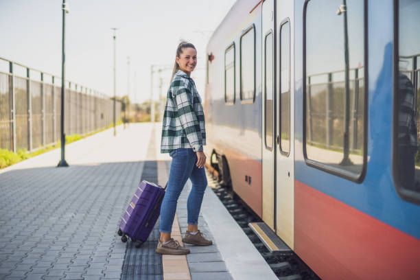 istock Woman enters the train 1459394656