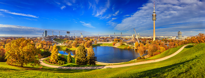 Autumn cityscape, panorama, banner - view of the Olympiapark or Olympic Park and Olympic Lake in Munich, Bavaria, Germany, 23 November, 2022