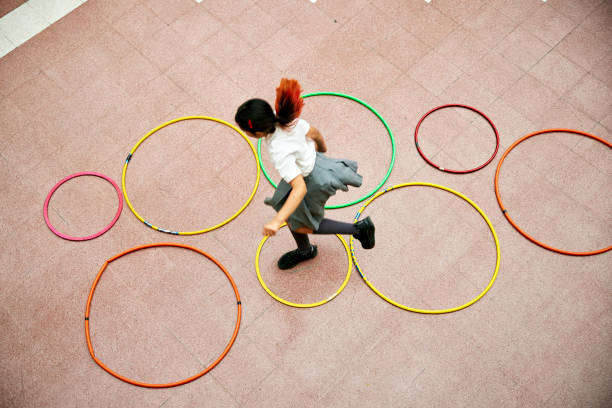 istock Private school student playing hopscotch 1459399604