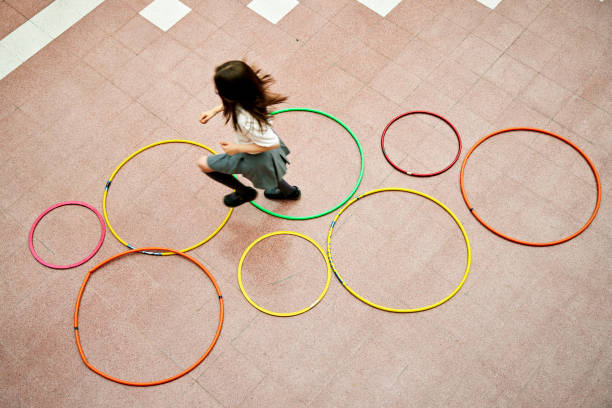 istock Schoolgirl playing hopscotch during recreation break 1459399616