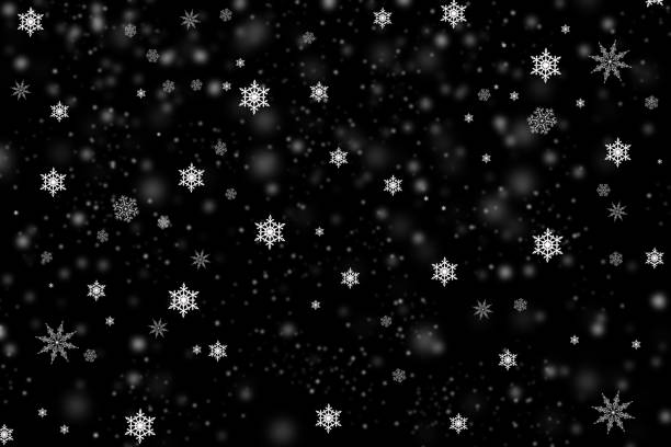 istock Falling snow flakes isolated on black realistic background 1459402240