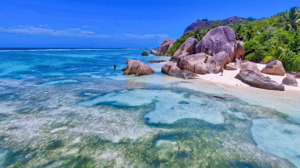 istock Amazing beach of Anse Source Argent in La Digue, Seychelles from drone 1459402466