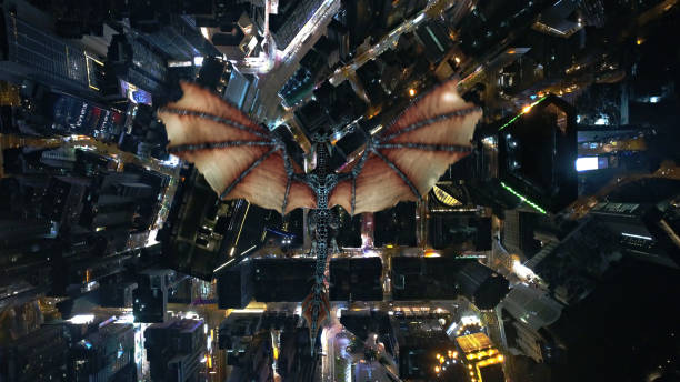 istock Dragon flying over the city at night 1459404427