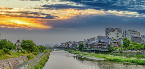 Kyoto skyline along the river at sunset, Japan.