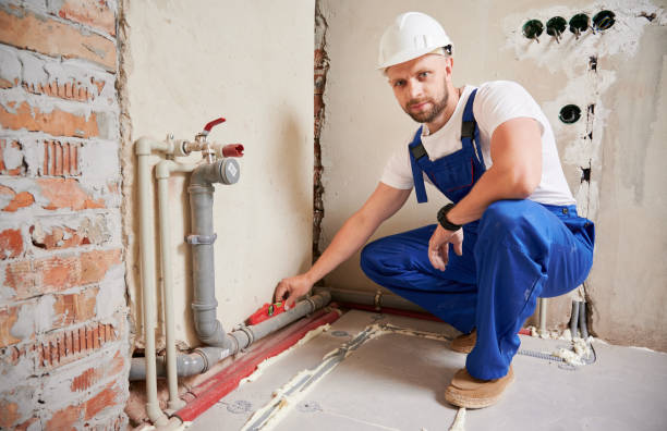 istock Man checking plumbing pipe with spirit level tool in apartment. 1459405777